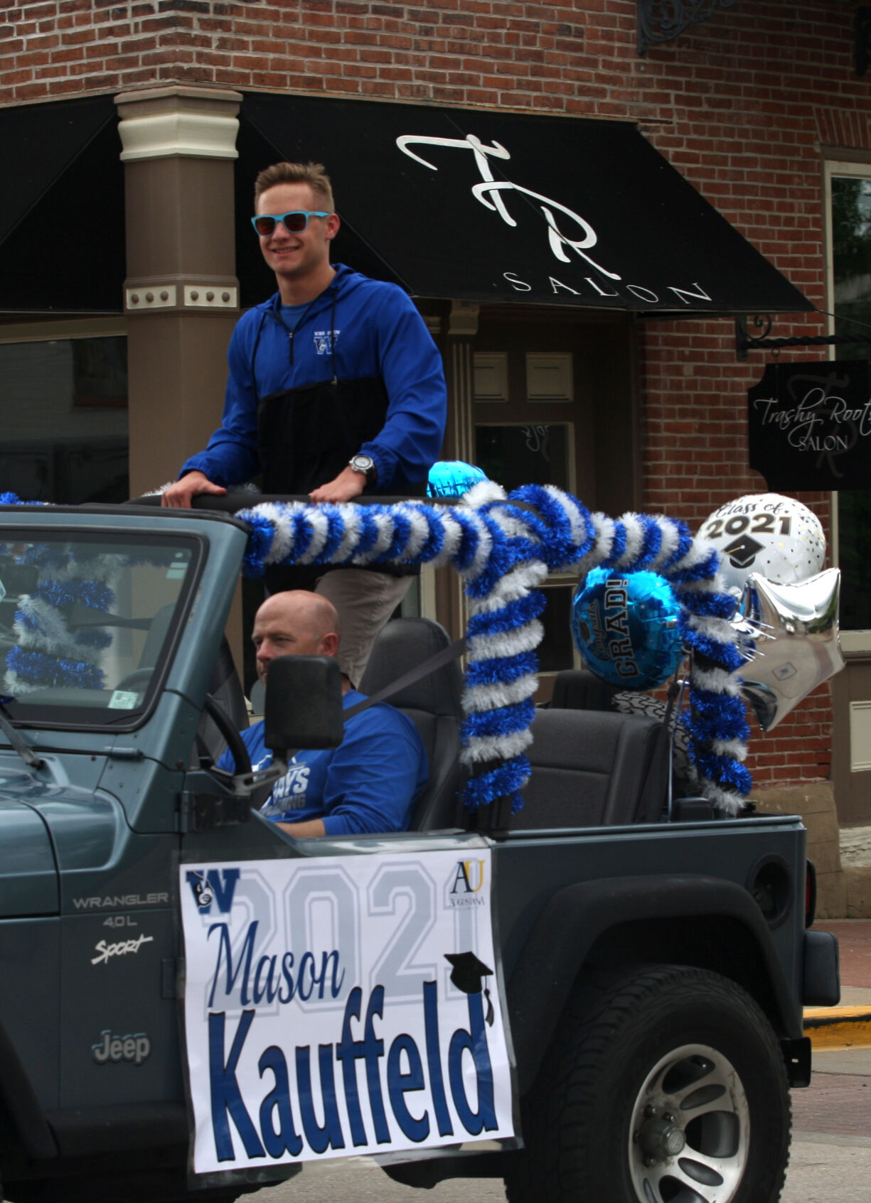 Mason Kauffeld rides through town